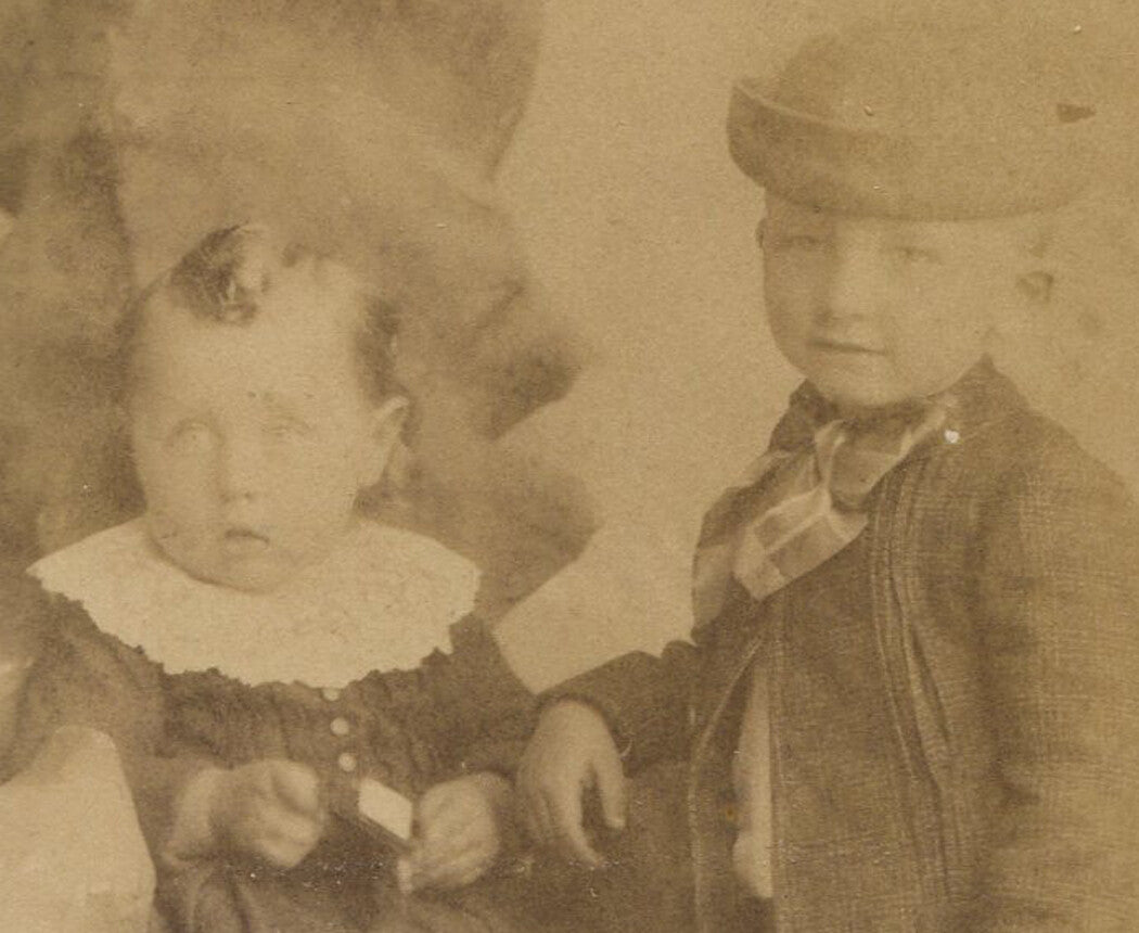 Vintage cabinet card photograph: siblings plotting their next move, Naperville, IL - black-and-white historical portrait