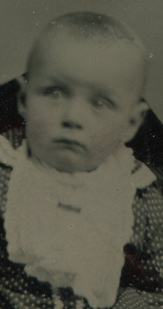 BABY IN BIB. TINTYPE IN PERIOD PAPER MAT.