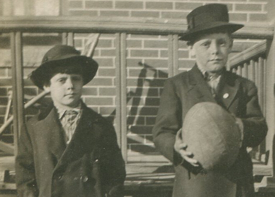 BOYS IN KNICKERS AND HATS, HOLDING A LARGE BALL. B W PHOTO.