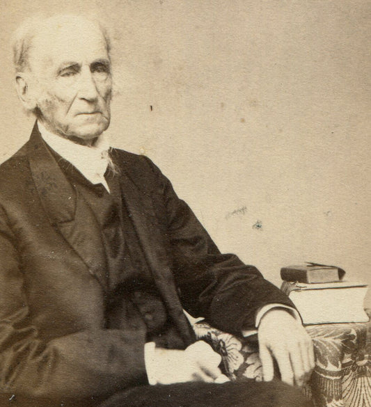 OLD MAN POSED SEATED AT TABLE WITH BOOKS. CDV. PAWTUCKET, R.I.