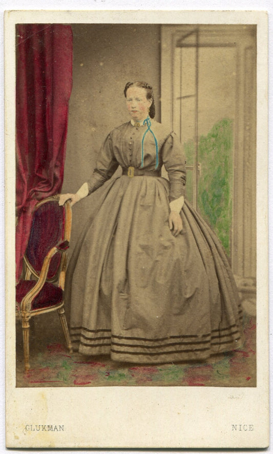 WOMAN, STANDING POSE. PAINTED BACKGROUND, TINTED CDV. DUBLIN, IRELAND.