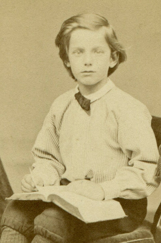 HANDSOME YOUNG HANDSOME RELAXED SEATED POSE WITH BOOK. CDV. IPSWICH, ENGLAND.