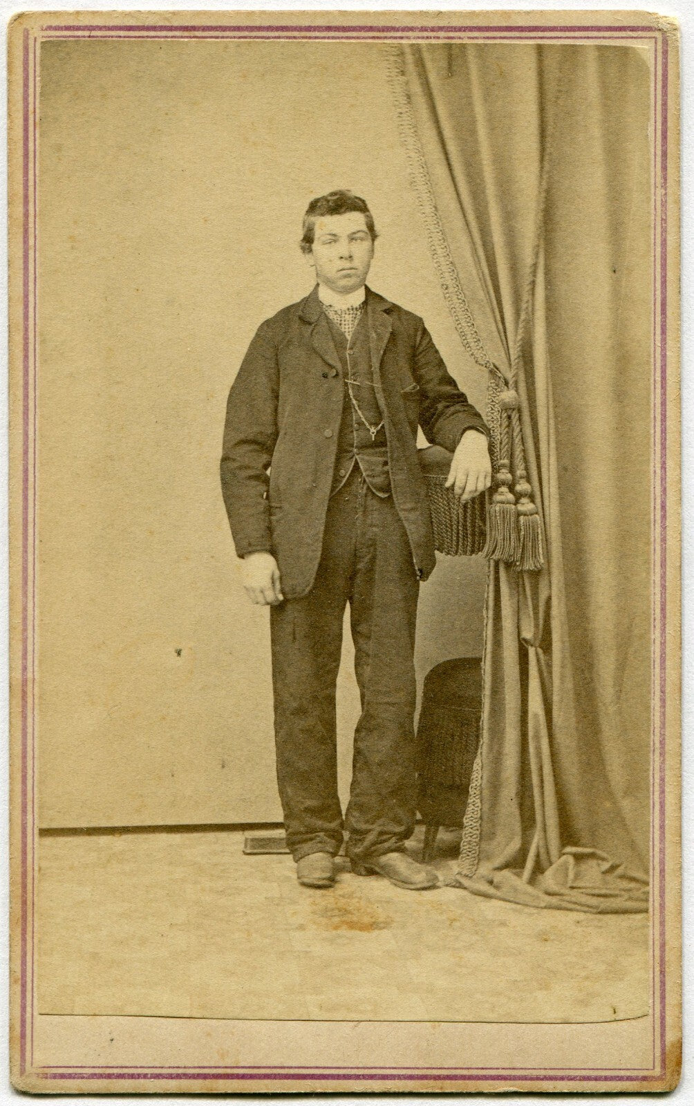 MAN, STANDING POSE IN POSING STAND. CDV. SUNBURY, PA.