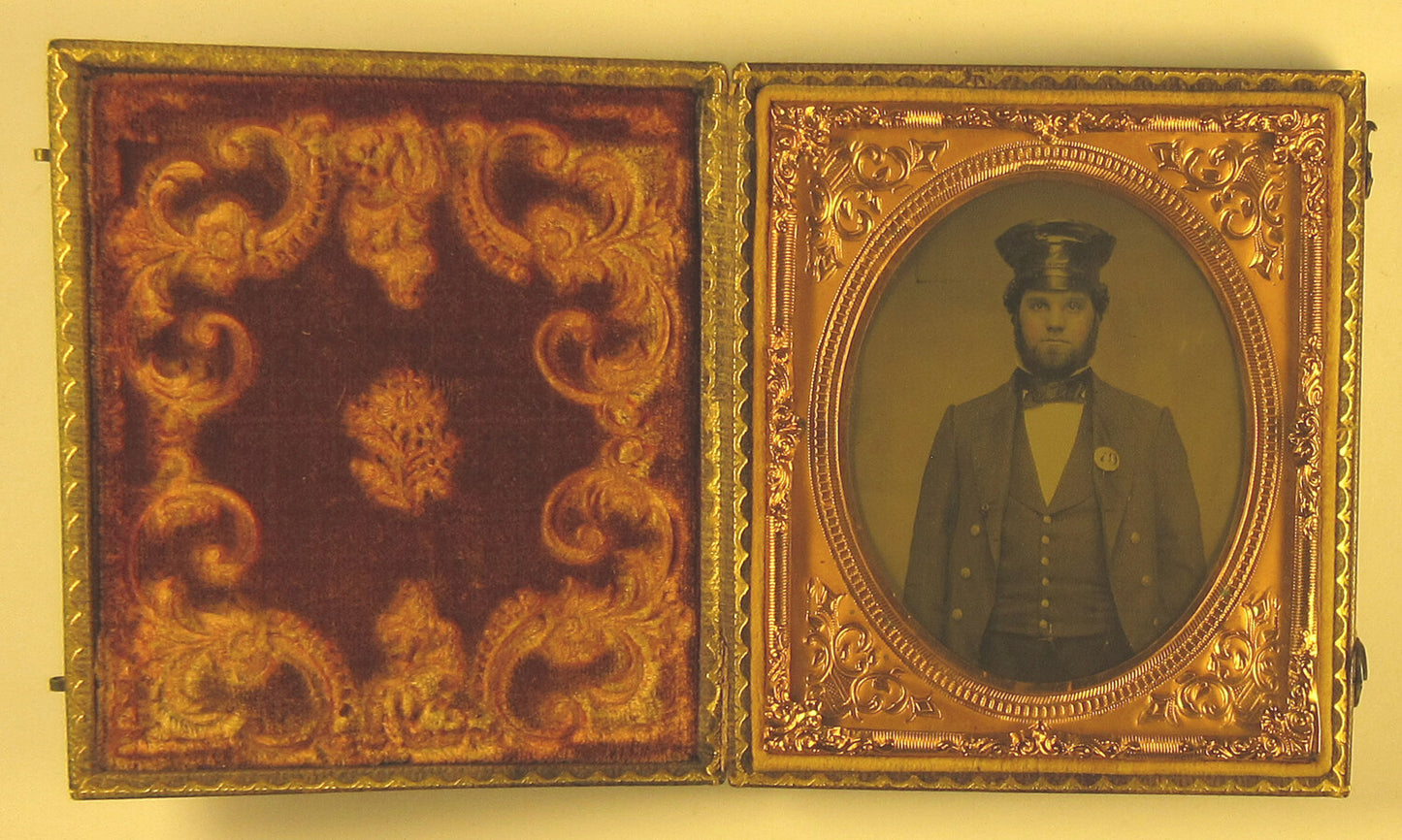 OCCUPATIONAL, FIREMAN/TRAIN OPERATOR. TINTED 6TH PLATE AMBROTYPE. FULL CASE.