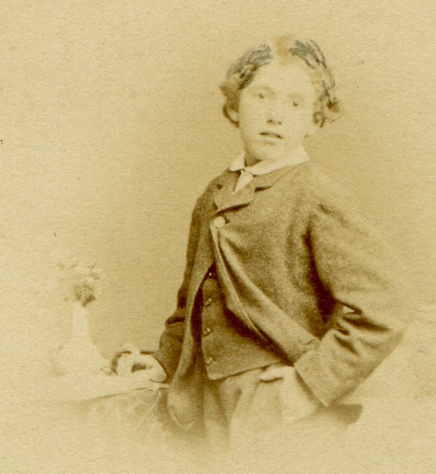 YOUNG BOY POSED W/ HAND IN POCKET, JACKET OPENING SWEPT ASIDE. CDV. JERSEY, U.K.