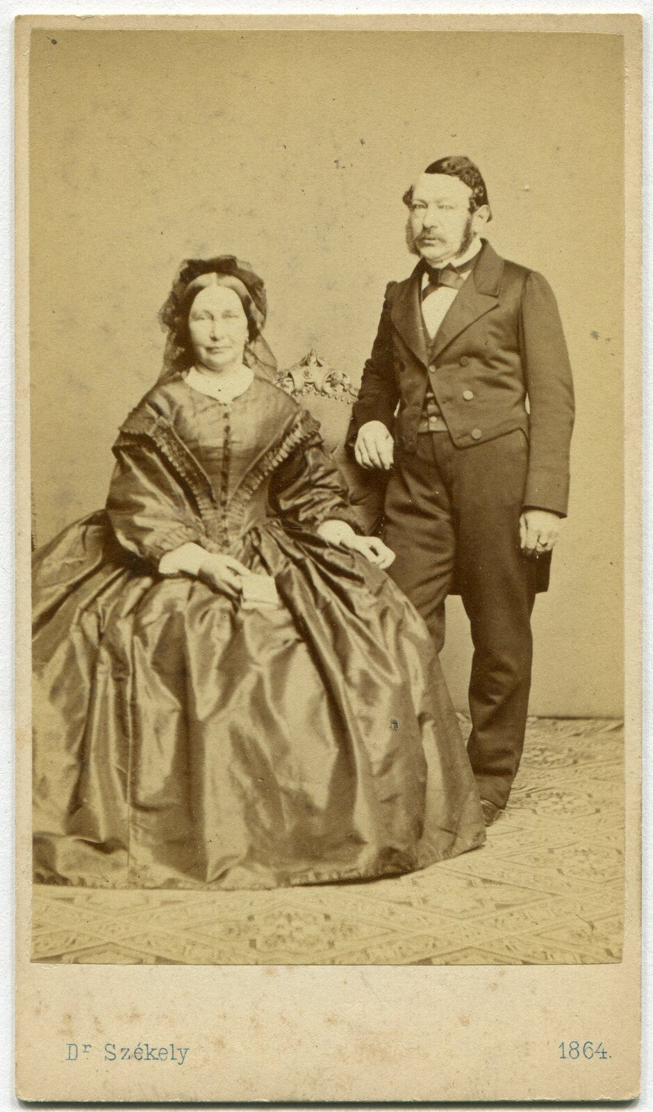 COUPLE POSED, DRUNK WOMAN HOLDING BOOK. CDV, 1864, WIEN, AUSTRIA.