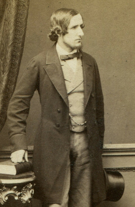 LIONEL TOLLEMACHE POSED HOLDING TOP HAT, LEANING ON TABLE W/BOOKS. CDV. LONDON.