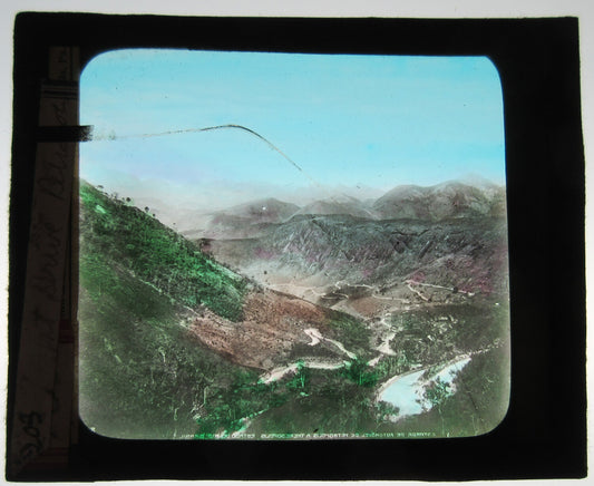 BEAUTIFUL VIEW OF WINDING MOUNTAIN ROAD. HAND COLORED PHOTO ON GLASS.
