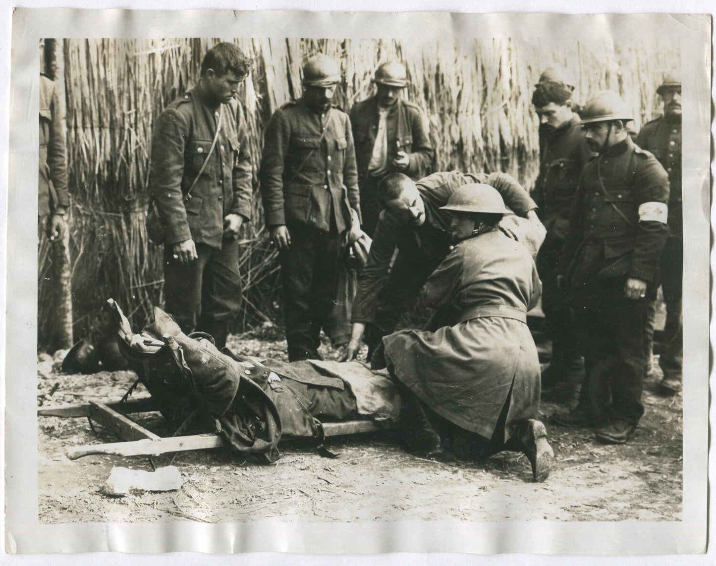 BRITISH WOMAN MEDIC TENDING WOUNDED IN BATTLE. WWI. (8X10 REPRINT)