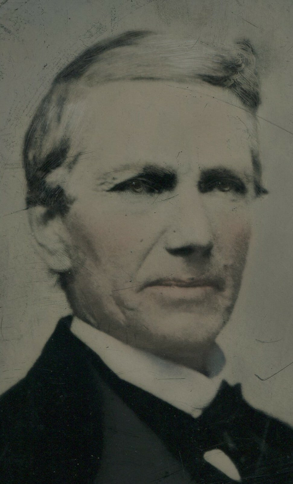 MAN W/DEEP SET EYES. TINTED TINTYPE 8.5X6.5 IN.