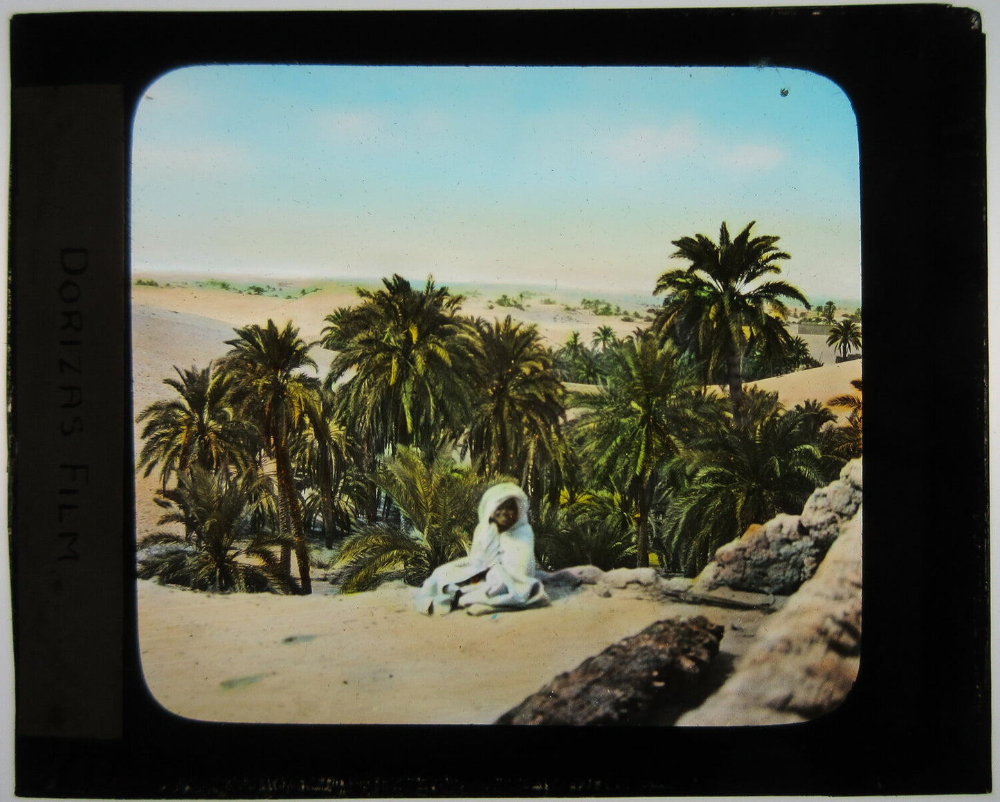 Vintage Magic Lantern Slide - Tinted Photo of Figure in White Wrap Seated Under