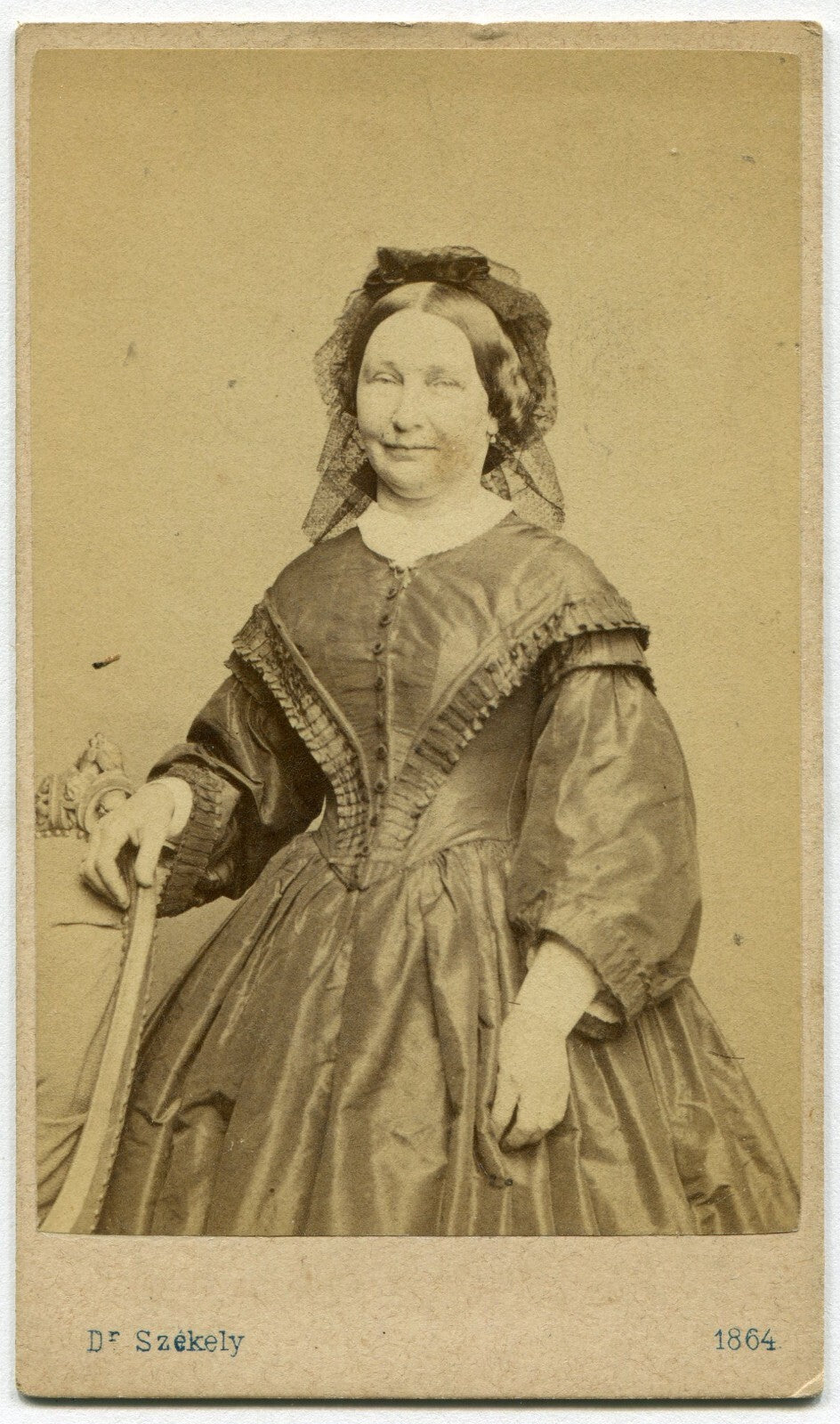 WOMAN W/DRUNK EXPRESSION AND HOLDING ON TO CHAIR. CDV. WIEN, AUSTRIA.