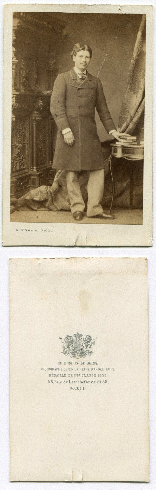 MAN IN LONG COAT POSED AT TABLE W/BOOKS. CDV. PARIS, FRANCE.