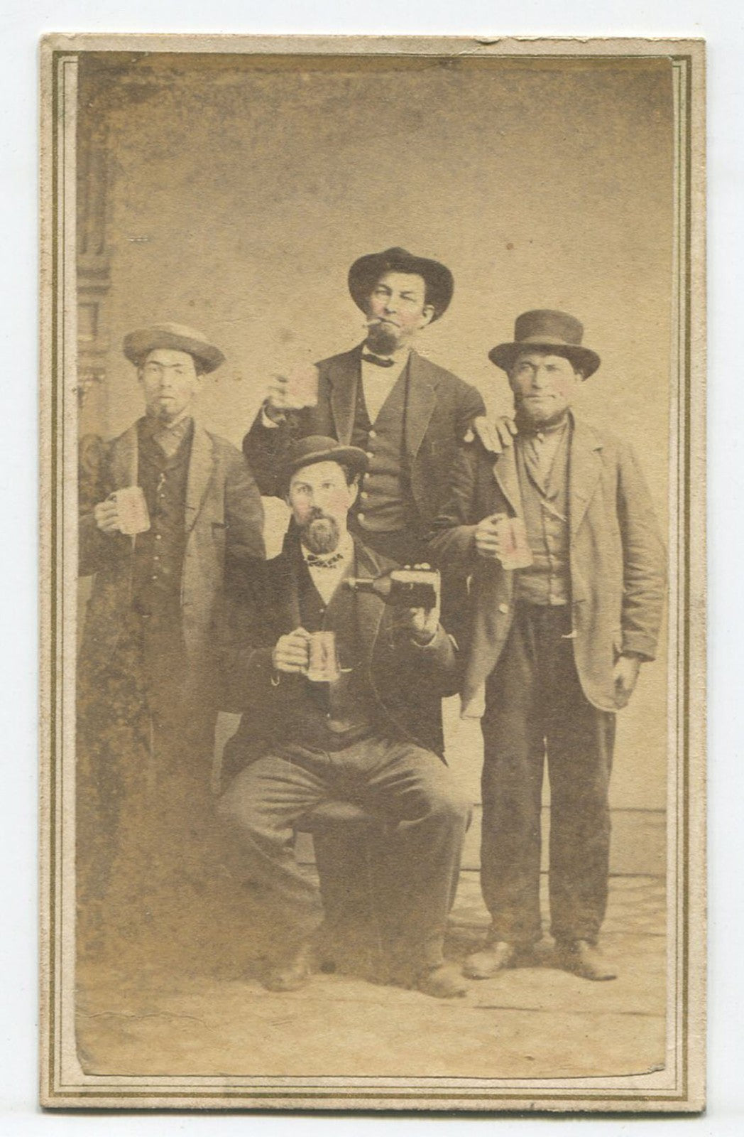 MEN IN HATS POSED HOLDING BEER MUGS, BOTTLE. TINTED CDV. COSHOCTON, OHIO.
