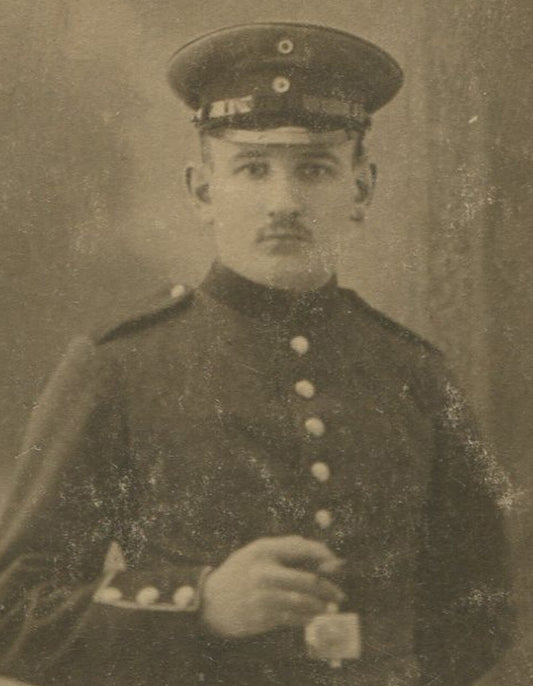 WWI ERA SOLDIER HOLDING CIGARETTE. PHOTO POSTCARD.