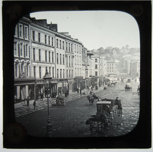BUSY STREET SCENE WITH HORSE AND CARRIAGE. LANTERN SLIDE.