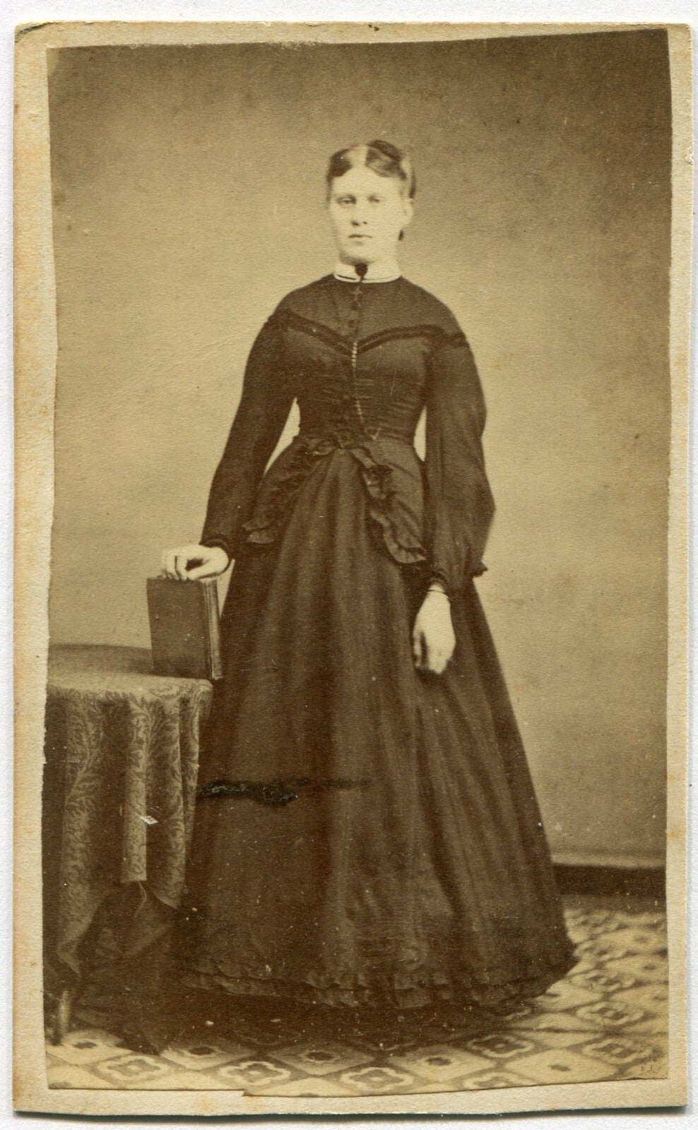 WOMAN STANDING POSE AT TABLE W/BOOK IN HAND. CDV. SELINSGROVE, PA.