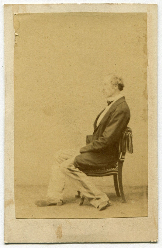MAN, LAZY PROFILE POSE, FEET/LEGS ODDLY POSITIONED. CDV.