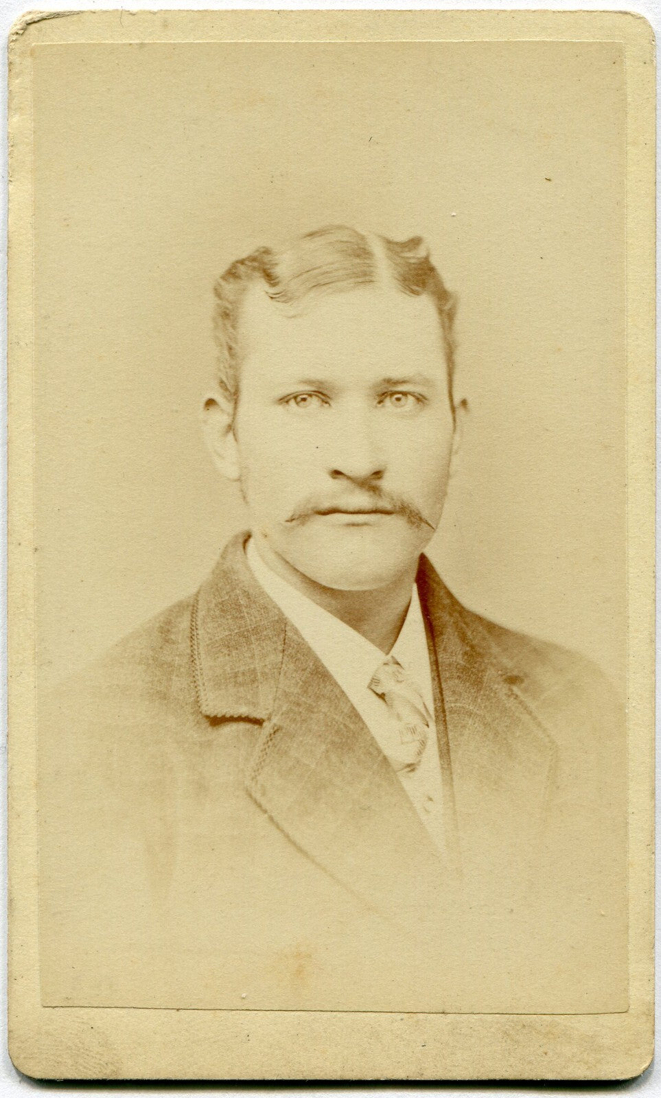 MAN W/MUSTACHE, PLAID SUIT. CDV. MT. PLEASANT, IOWA.