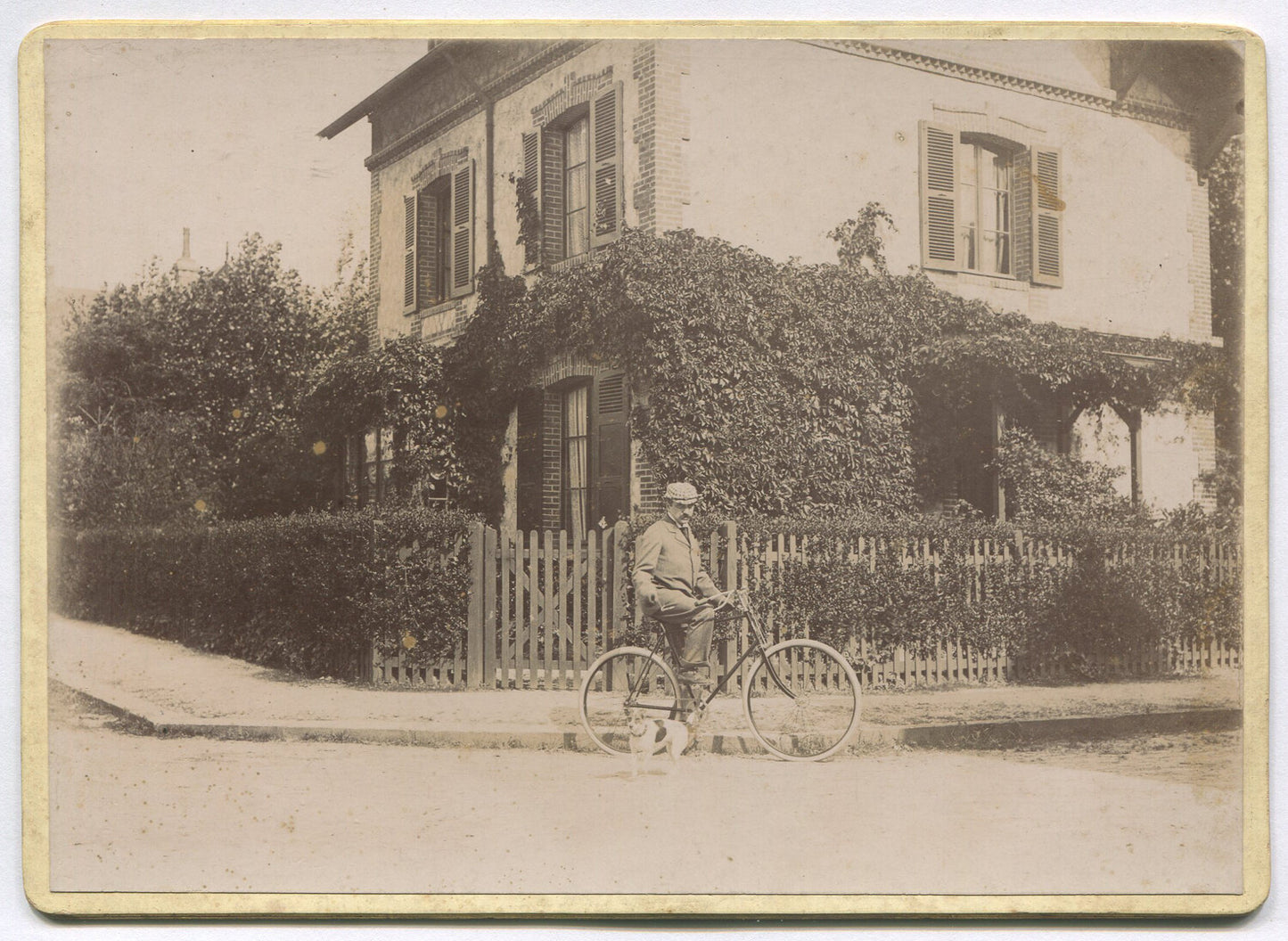 Authentic Vintage 5x7 Cabinet Card: Man on Bicycle by House with Picket Fence,