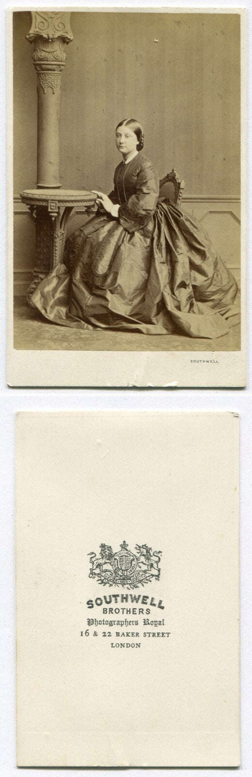 WOMAN SEATED W/HANDS ON TABLE, MIDDLE GAZE. CDV. LONDON, ENGLAND.
