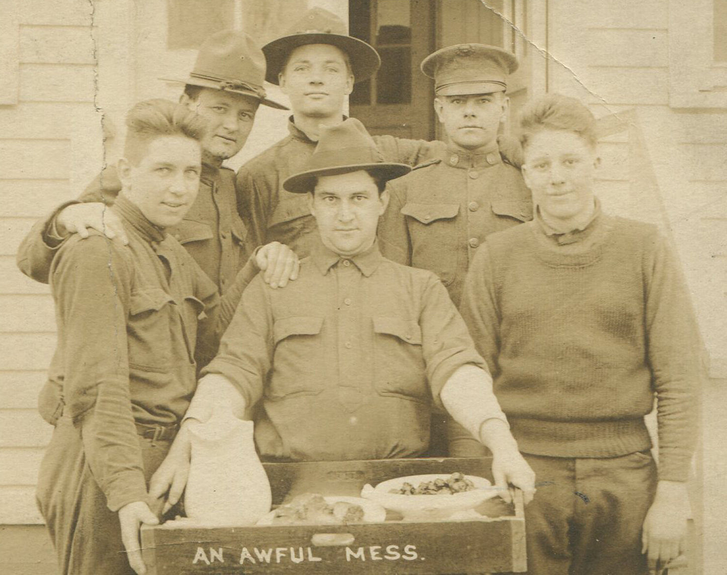 U.S. ARMY, PHOTO POSTCARD. SOLDIERS COMPLAINING ABOUT, "AN AWFUL MESS". FOOD.