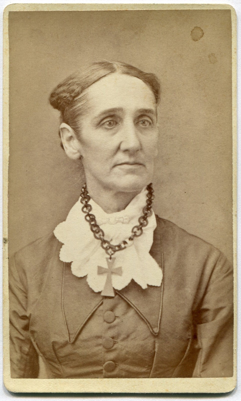 LONG FACED WOMAN W/CRUCIFIX NECKLACE. CDV. ELMIRA, N.Y.