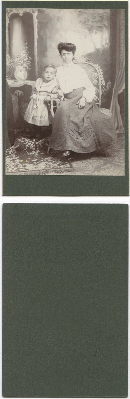 MOTHER IN GLASSES, W/CHILD. PAINTED BACKGROUND CABINET CARD.