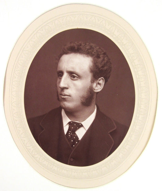 WALTER W. OULESS. 4.5X3.5 OVAL WOODBURYTYPE ON 11.25X8.5 INCH PAGE IN 11X14 MAT.