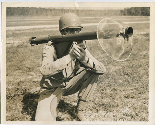 U.S. SOLDIER IN SAFETY GEAR AIMING SHOULDER HELD WEAPON. WWII. (8X10 REPRINT)