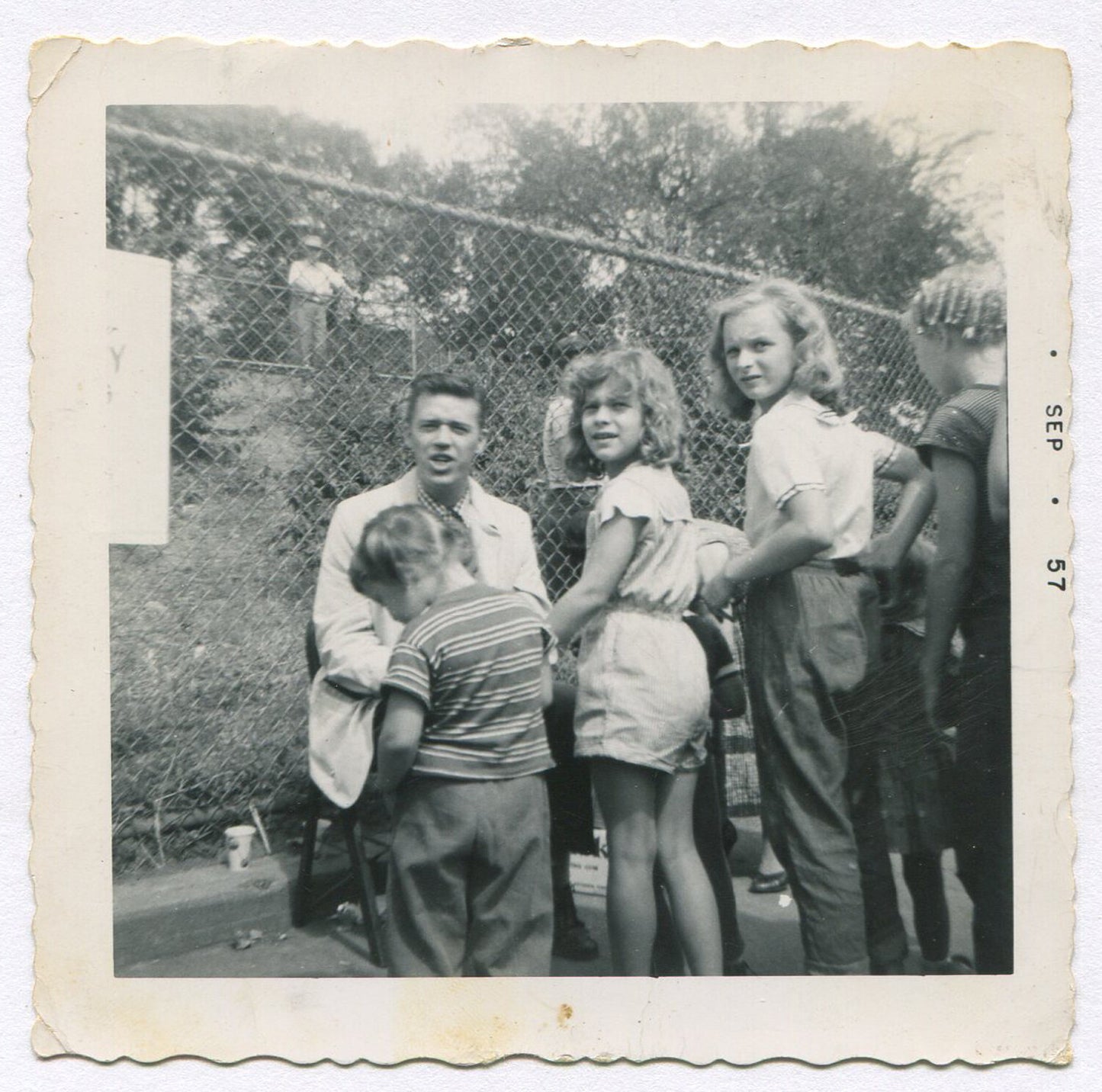 AMERICAN YOUTH. KODAK B&W SNAPSHOT 1957. 3.5X3.5. BLACK AND WHITE SILVER PRINT.