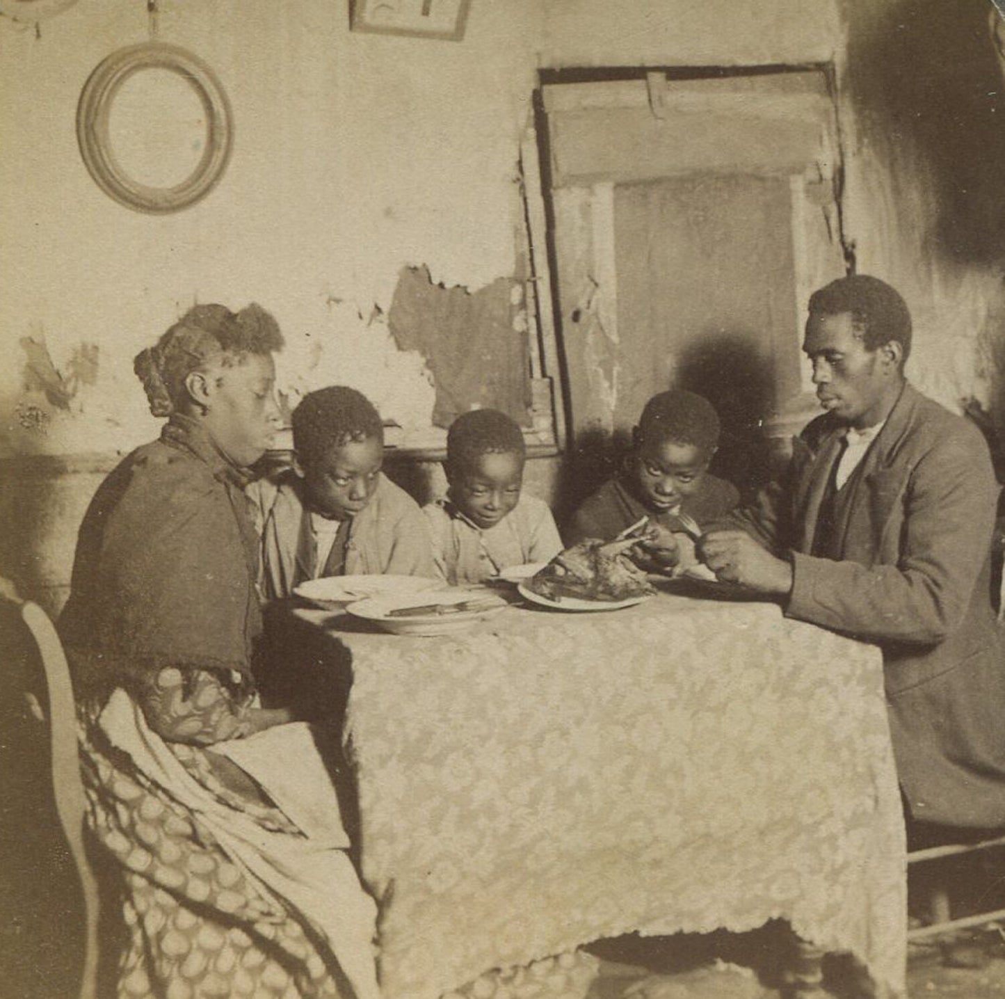 AFRICAN AMERICAN FAMILY AT DINNER TABLE. STEREOVIEW.