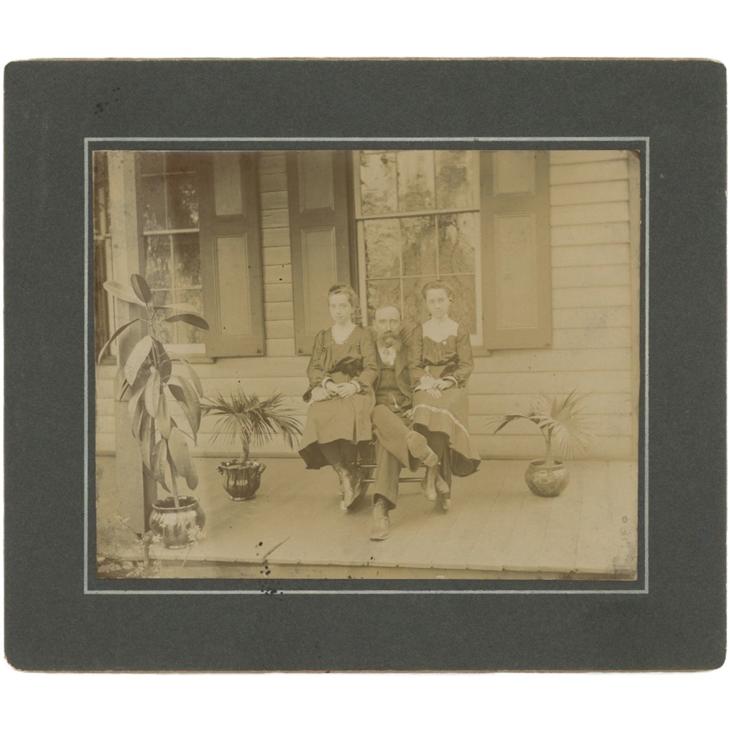 Vintage family portrait: man with two daughters on porch, mustache, retro wall art, archival photo print