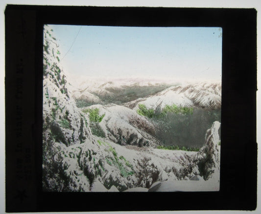 WINTER ON MT. WILSON. HAND COLORED PHOTO ON GLASS.