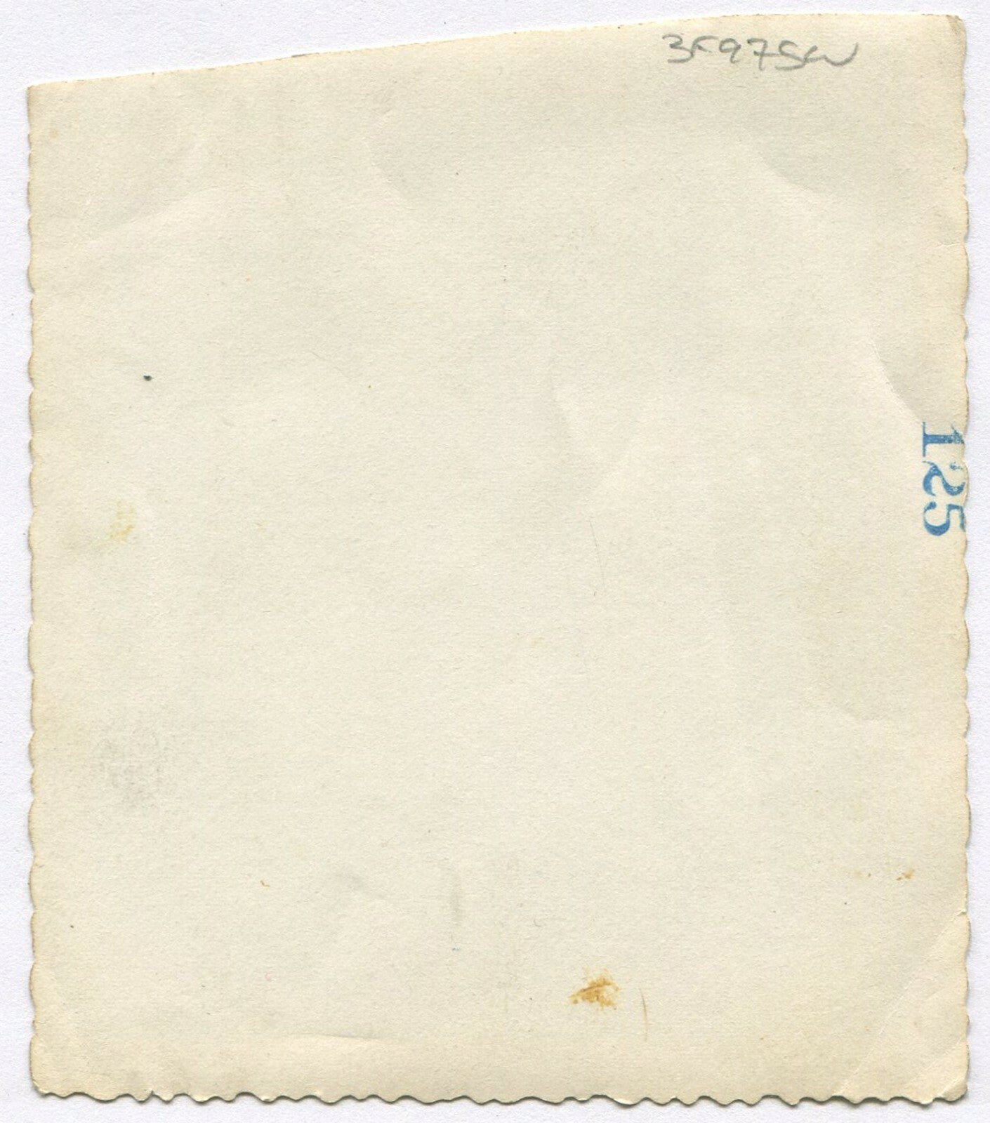 AFRICAN AMERICAN WOMAN POSED IN FRONT OF UPHOLSTERY SHOP. B&W SNAPSHOT.