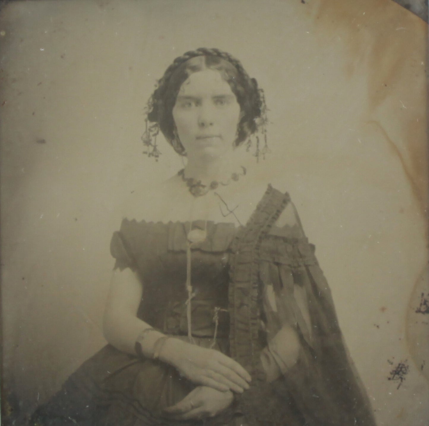BEAUTIFUL, HAUNTING AMBROTYPE OF A WOMAN. 5X7 FRAME WITH ARCHIVAL MATTING.