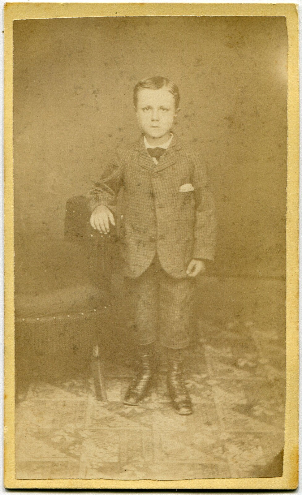 YOUNG BOY IN NEW SUIT, STANDING POSE. CDV BY EXCELSIOR TRAVELING ARTIST.