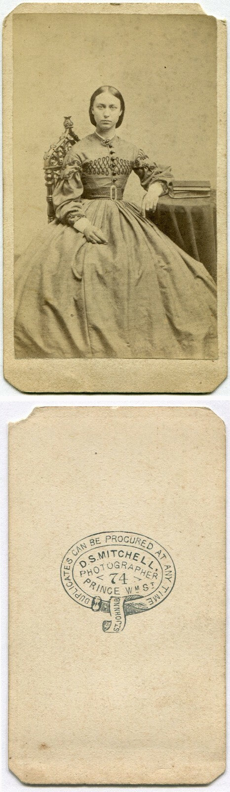 WOMAN, DIRECT STARE, SEATED W/BOOK ON TABLE. CDV. ST. JOHN, NEW BRUNSWICK, CA.