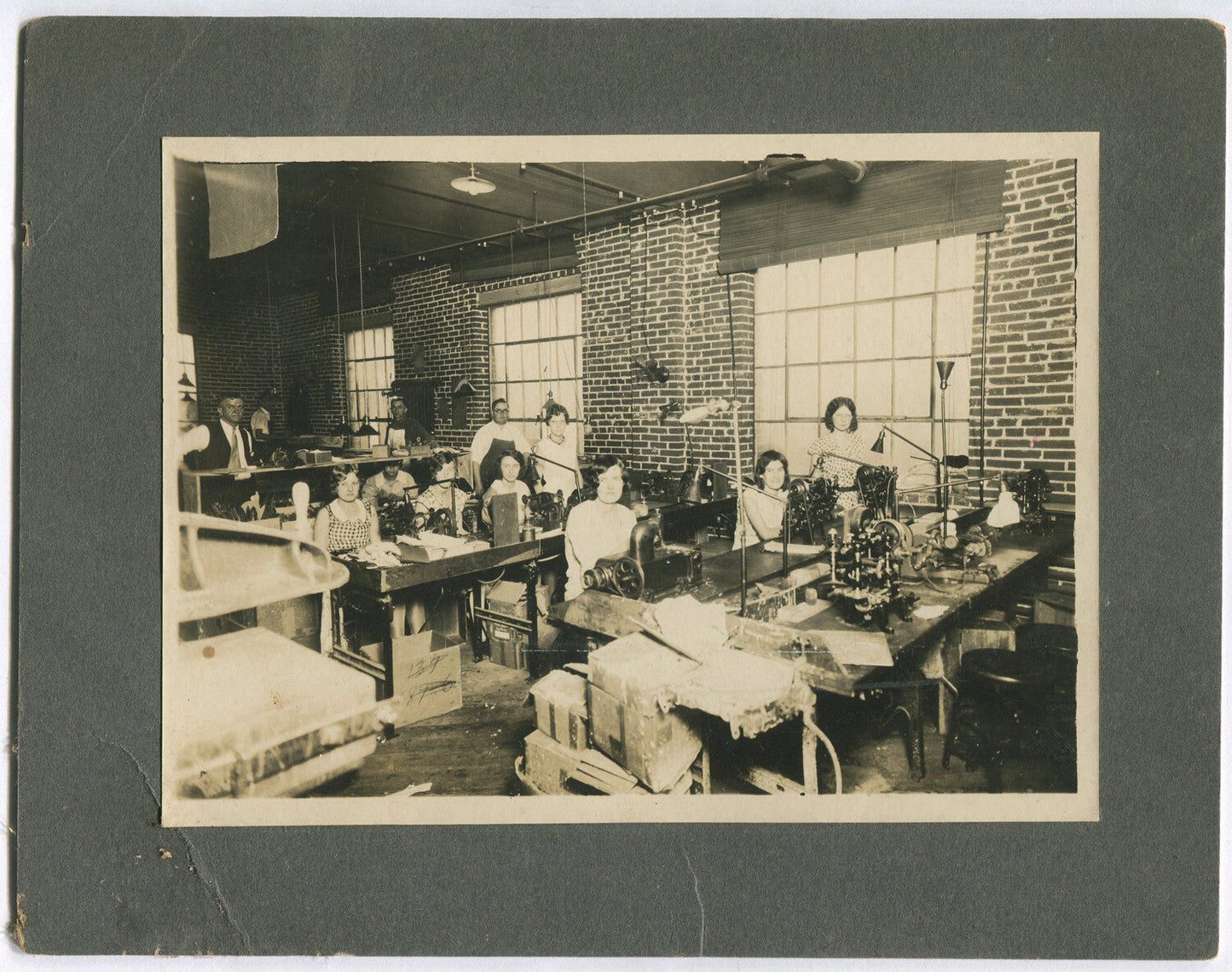 OCCUPATIONAL, WOMEN AT SEWING MACHINES. 5X7 B&W PHOTO ON 7X9 BOARD.
