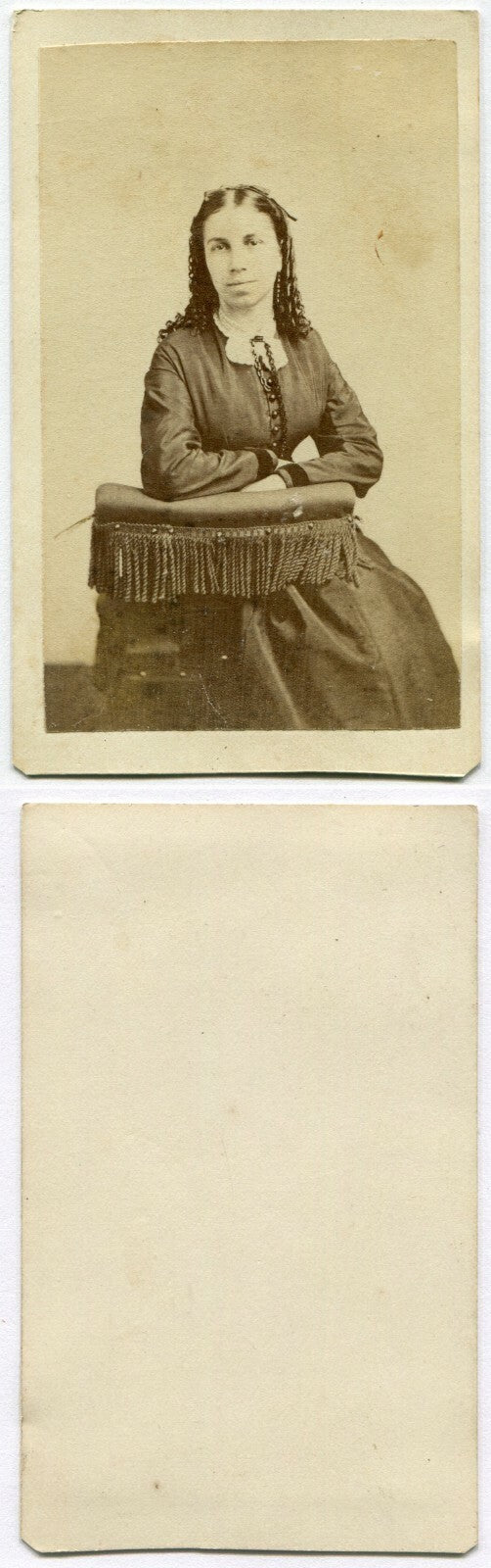 WOMAN, LONG RINGLET CURLS, SEATED AT POSING CHAIR. CDV.