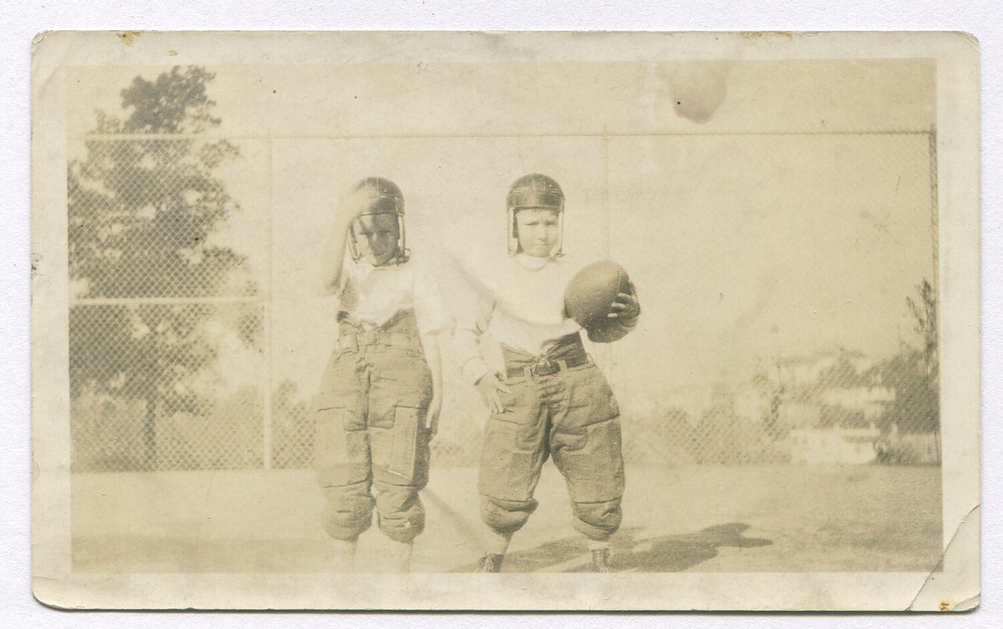 BOYS IN EARLY FOOTBALL UNIFORMS. 4.5X2.75 TONED B&W.1920-30s.