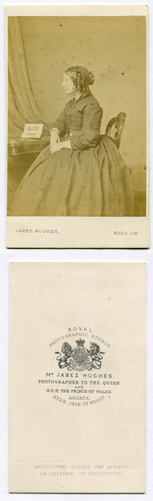 WOMAN W/RINGLET CURLS, POSED SEATED W/PHOTO ALBUM. CDV. ISLE OF WIGHT, ENGLAND.
