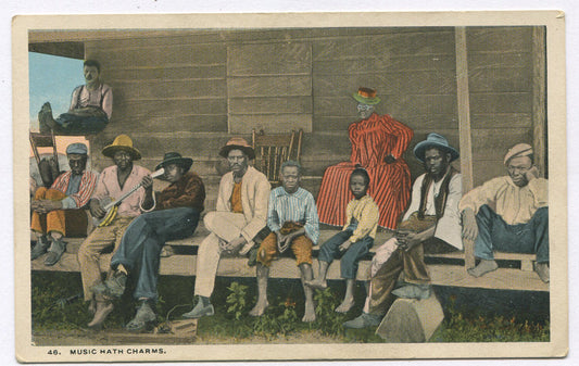 AFRICAN AMERICAN MAN PLAYING BANJO FOR FRIENDS AND FAMILY. POSTCARD, COLOR LITHO