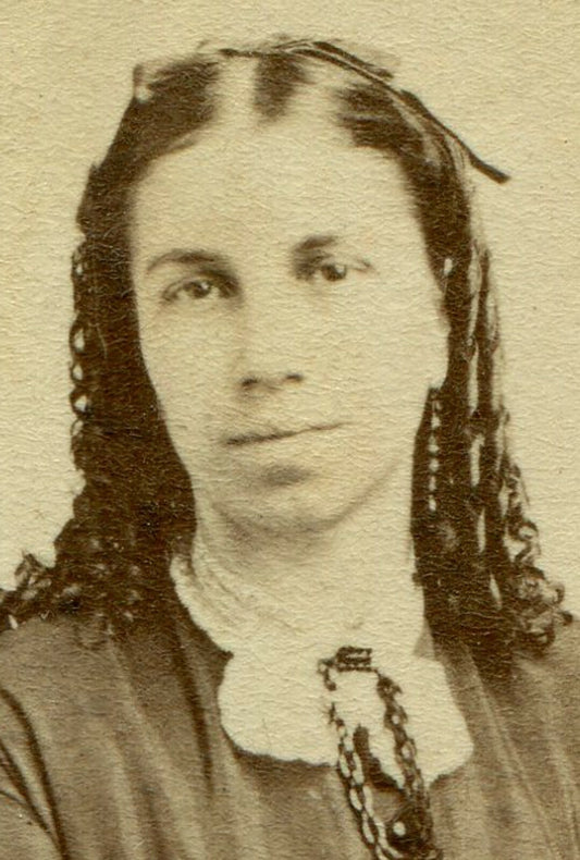 WOMAN, LONG RINGLET CURLS, SEATED AT POSING CHAIR. CDV.