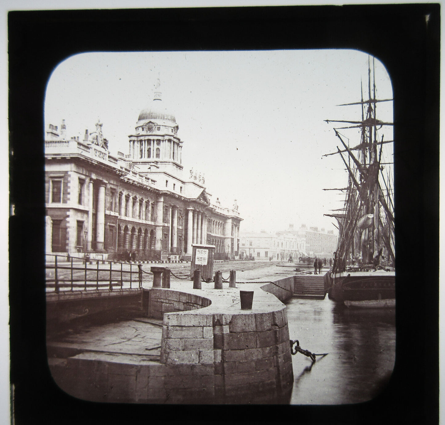 TALL SHIP DOCKED NEXT TO ORNATE BUILDING.LANTERN SLIDE.