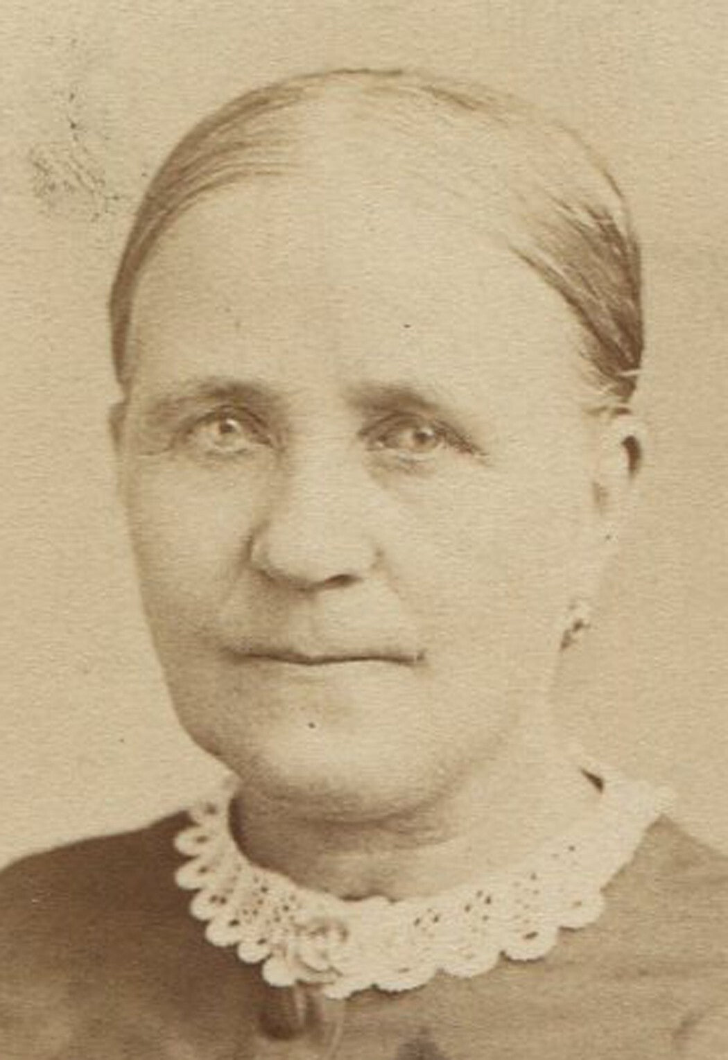 WOMAN WITH SLICK BACK HAIR AND SLIGHT GRIN. ALLEGHENY, PA.