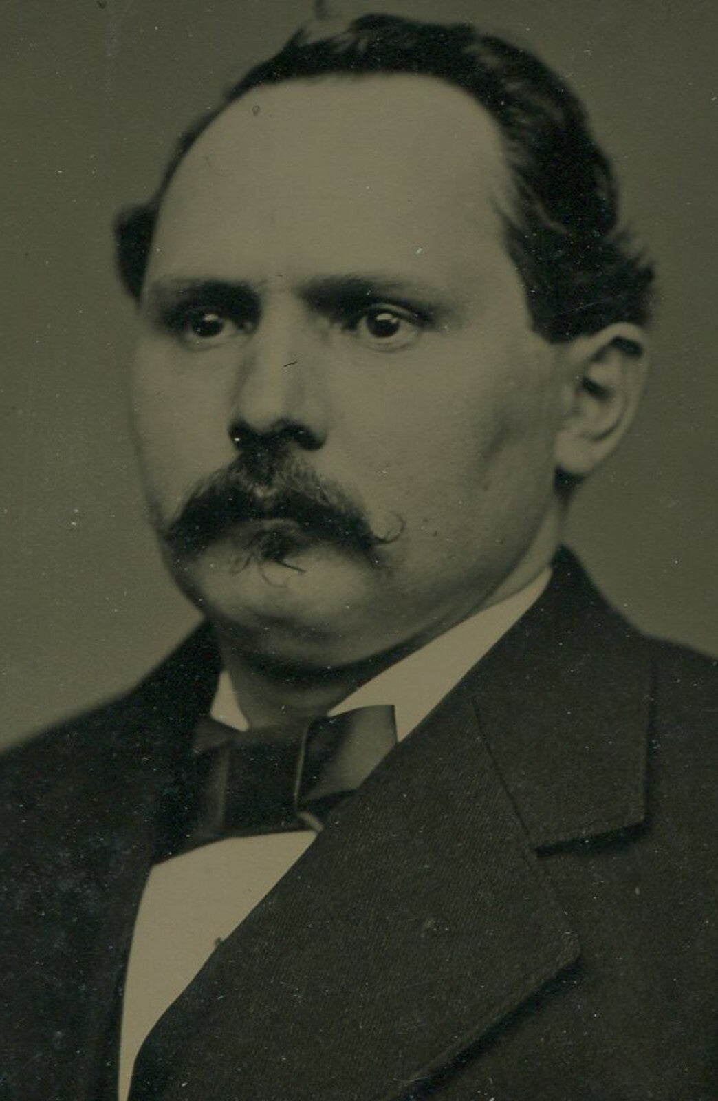 STOIC MAN, MUSTACHE, AND RECEDING HAIRLINE. CRISP TINTYPE IN PAPER MAT, 4 X 6 IN