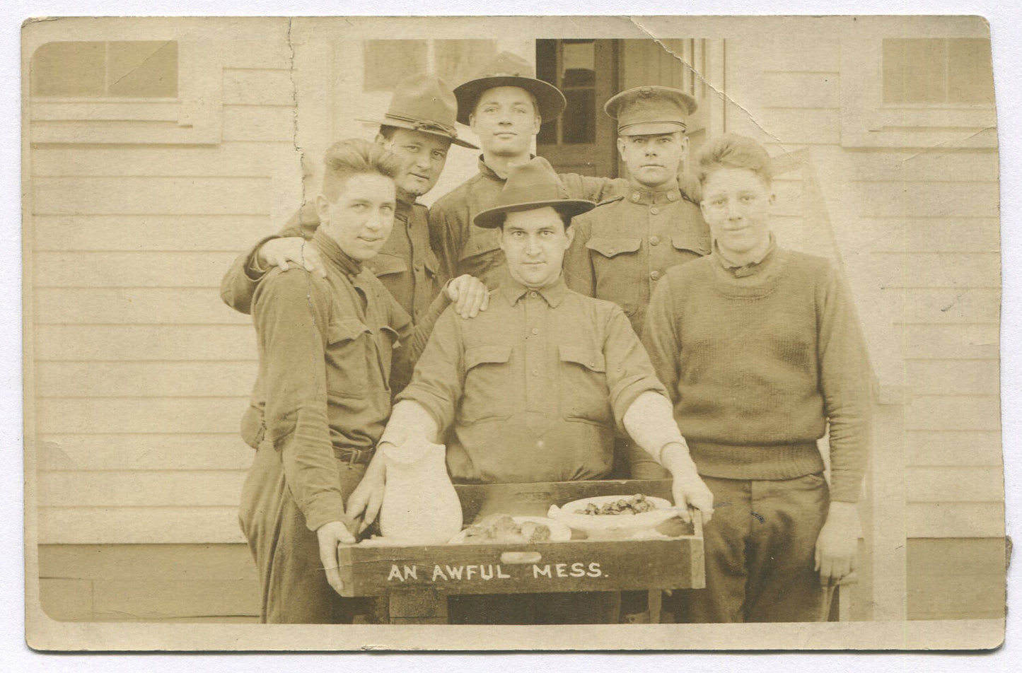 U.S. ARMY, PHOTO POSTCARD. SOLDIERS COMPLAINING ABOUT, "AN AWFUL MESS". FOOD.