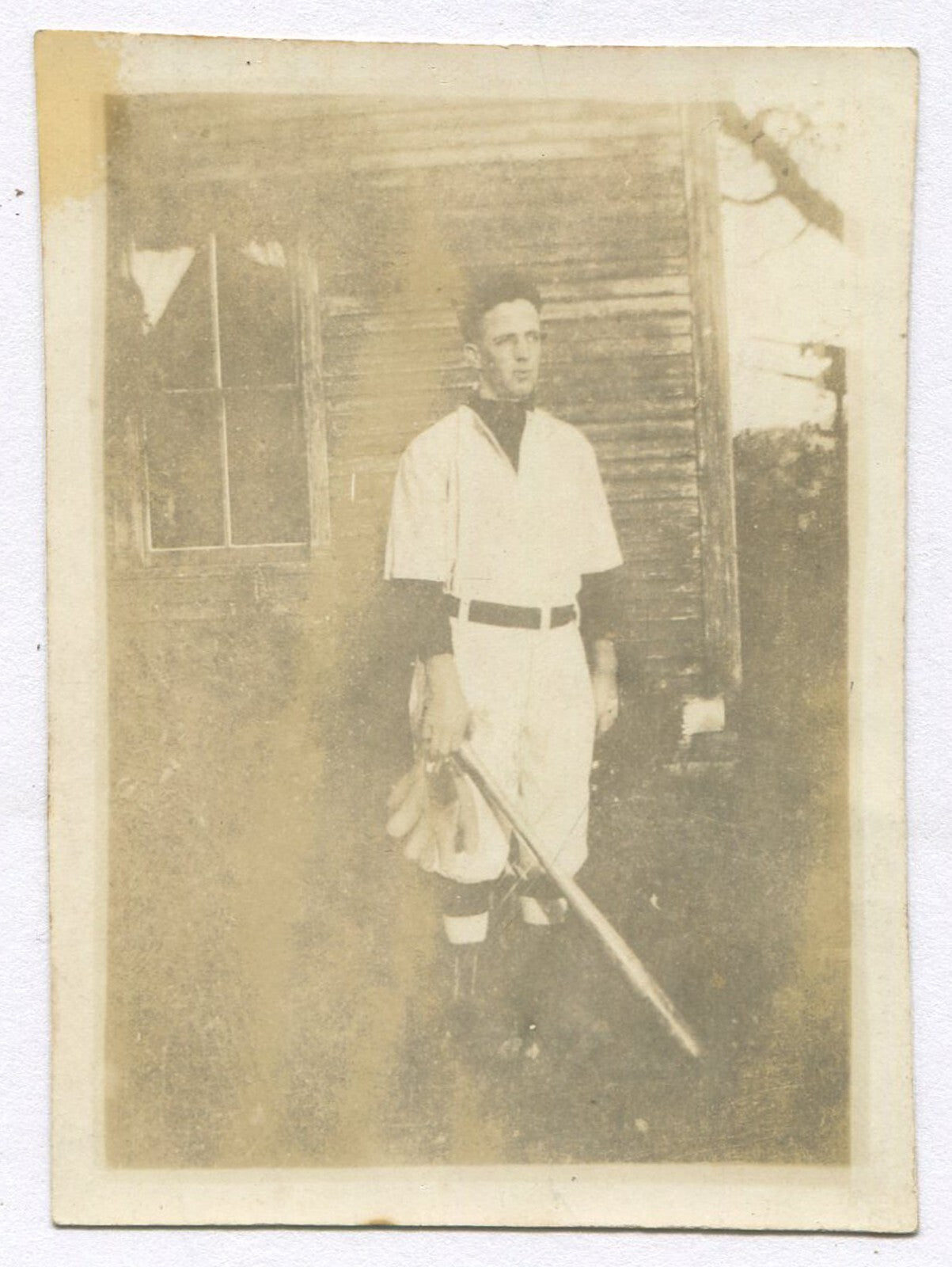 BASEBALL PLAYER IN UNIFORM. TONED SILVER PRINT 3.25X2.25. 1920-30s.