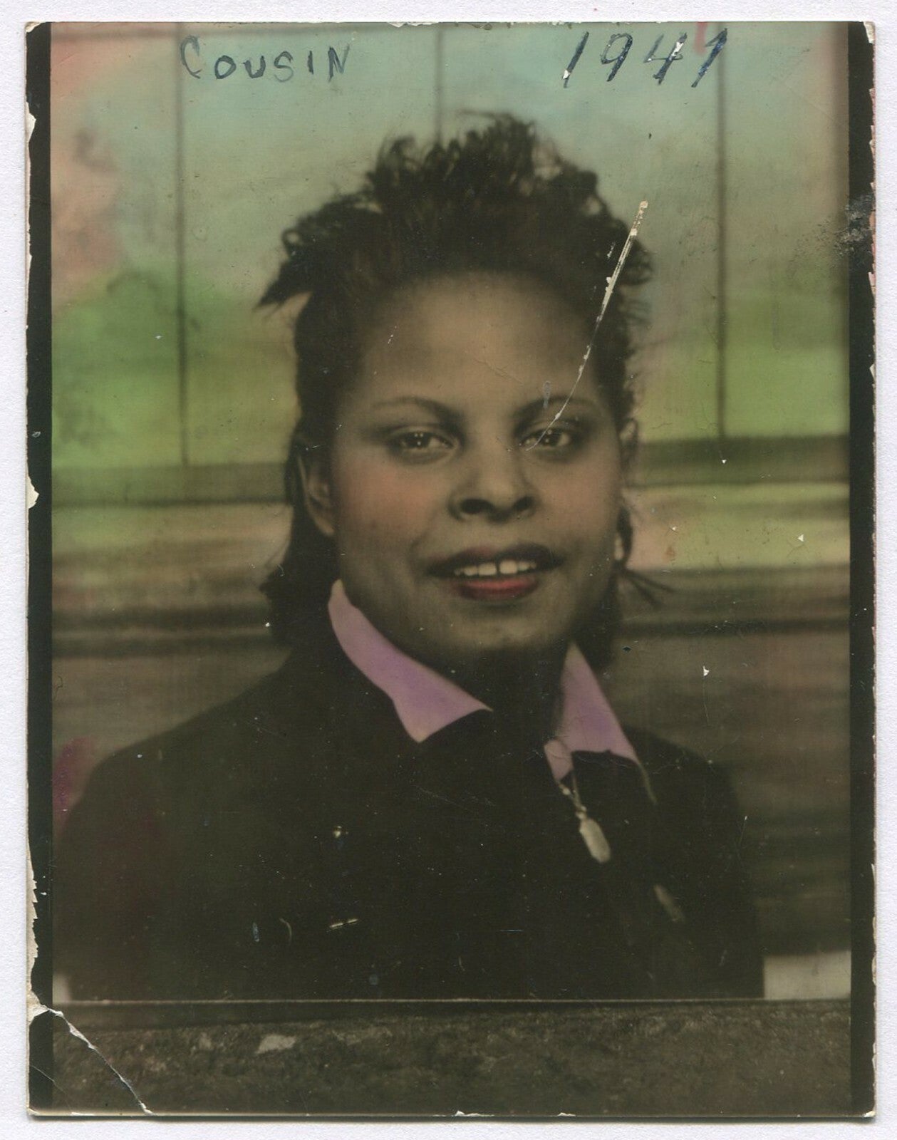 AFRICAN AMERICAN WOMAN, SMILING. 4.25X3.25 INCH, TINTED SILVER PRINT. 1940s.